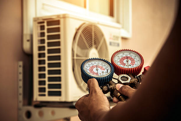 Professional Air Conditioning Service technician working in Perry, OH